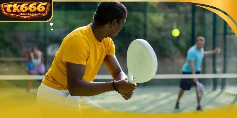 A technician measuring the moisture levels on a professional clay court